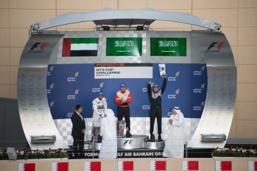 From left to right: Shk. Hasher Al Maktoum, Bandar Al Esayi (on the top step), and me (pointing up to my family & friends in the Grand Stand)